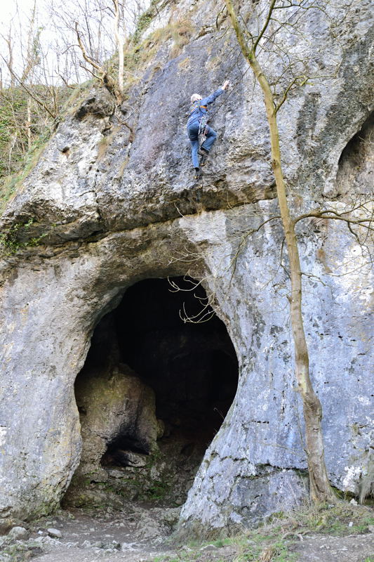 Rock climber above Dove Holes, Dovedale.