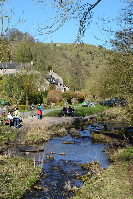 People milling around at The Mill Stream on the River Dove at Milldale