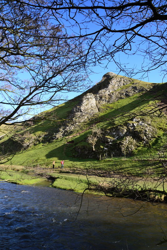 Thorpe Cloud rises steeply above the River Dove in Dovedale