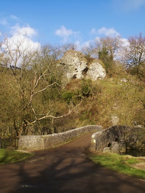 Nan Tor Cave and the bridge over the River Manifold at Wetton Mill