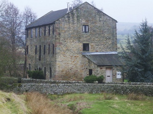 Brund Mill is a converted former corn mill with water wheel and restored mill workings