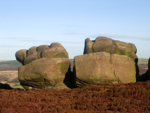 Gritstone like clenched fists shaped by the wind, rain and young rock climbers hands.