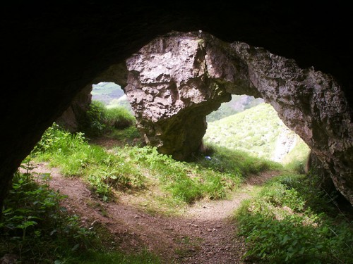 Looking through the archway from within a small cave. There are a number of small caves above Thor's Cave. This is one of the smaller ones