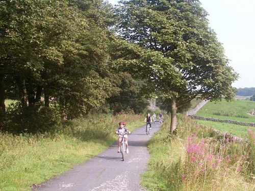 A family cycling on the Tissington Trail